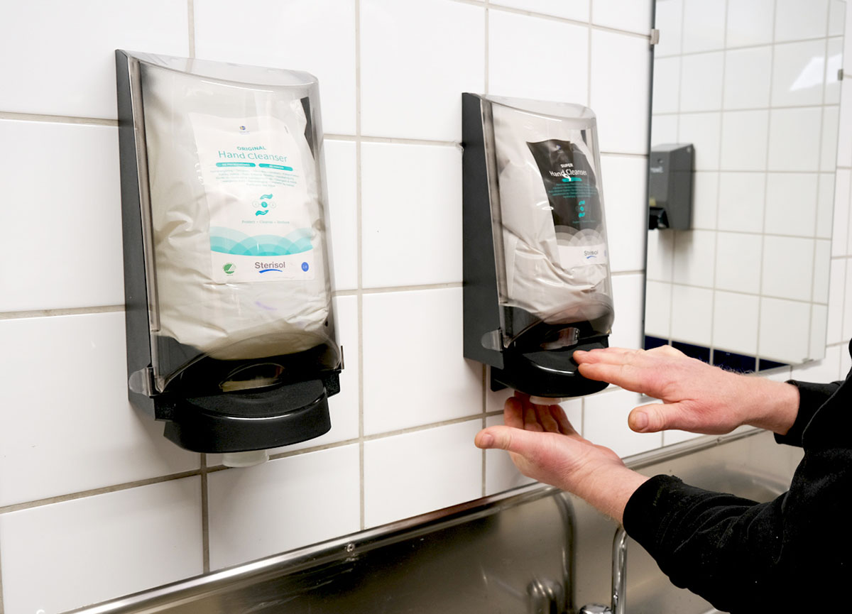 A dispenser with hand sanitizer
