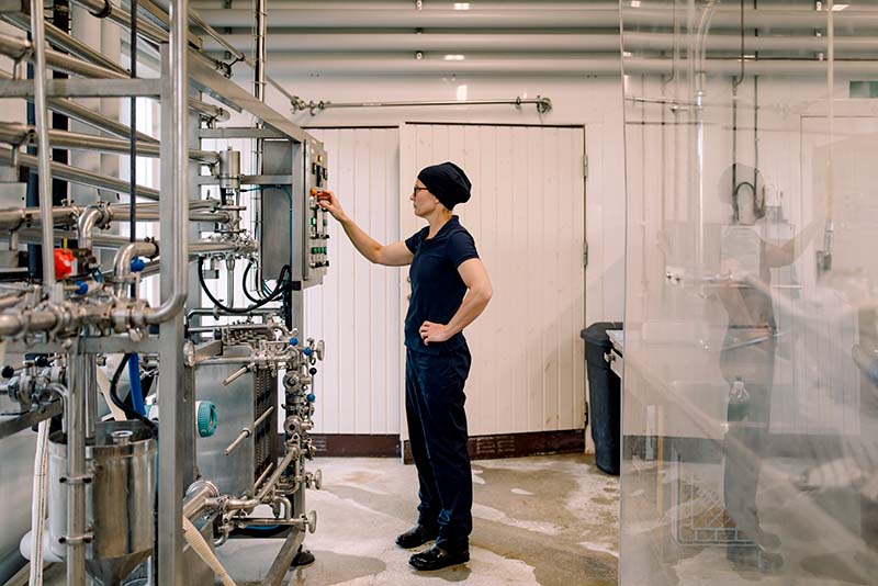 A woman in a food manufacturing facility