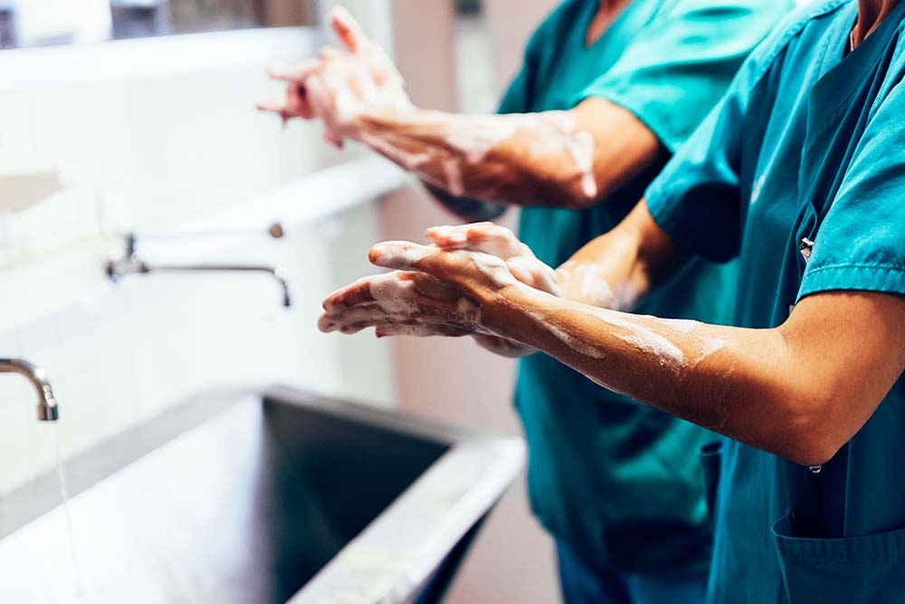 : Surgeons are washing their hands before surgery.